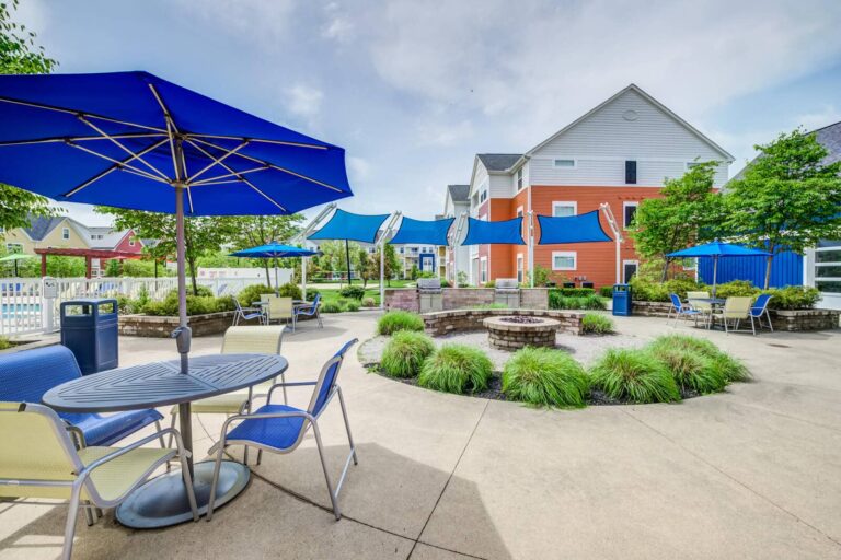 Outdoor fireplace, grills and lounge at our Worthington apartments.