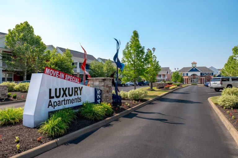 The luxury entrance sign at District at Linworth Apartments and Townhomes.